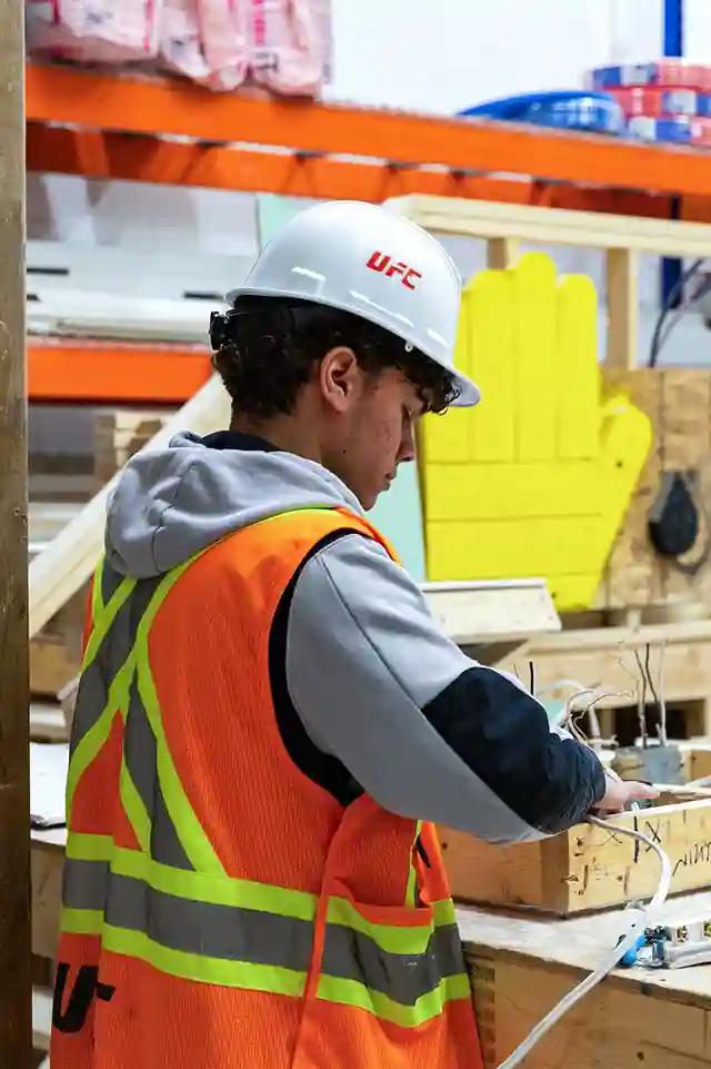 Construction team reviewing digital blueprints on site